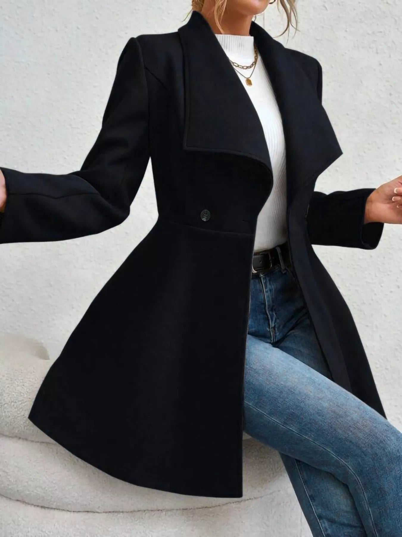 Collared neck double-breasted coat with buttons and lining — classic mid-length coat for cold-weather outfits. Black side view