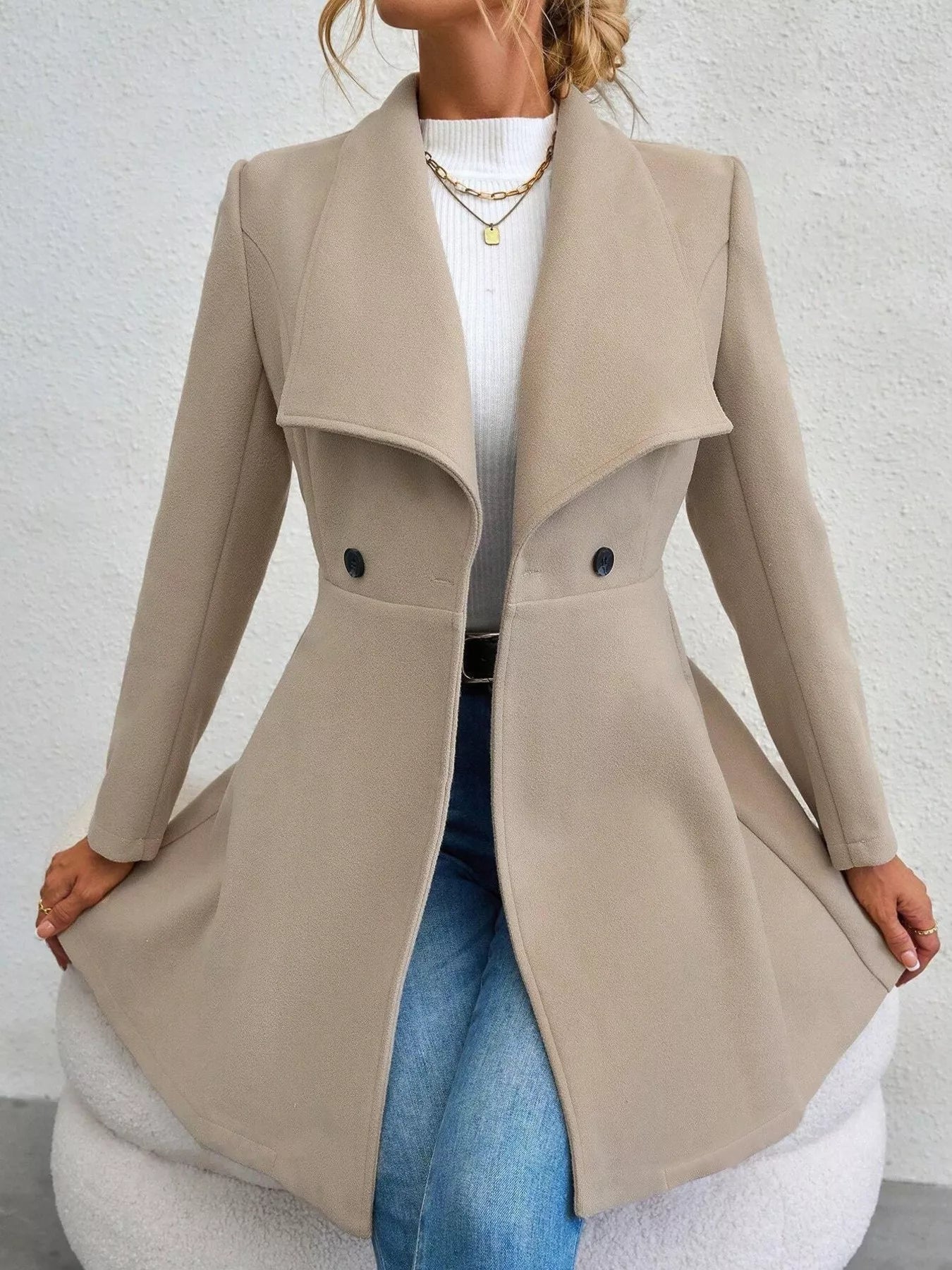 Collared neck double-breasted coat with buttons and lining—classic mid-length coat for cold-weather outfits. Apricot full view