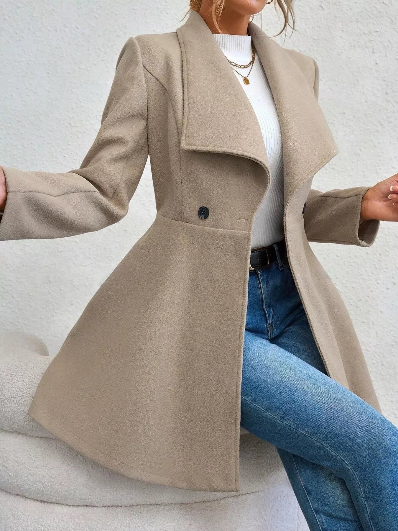 Collared neck double-breasted coat with buttons and lining — classic mid-length coat for cold-weather outfits. Apricot side view