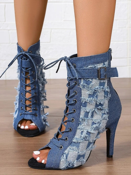 Front view of Distressed Denim Lace-Up Peep Toe Ankle Boots in Peacock Blue showing neckline and sleeve details (denim)
