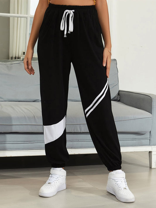 Front view of Drawstring Contrast Joggers with Pockets in Black showing neckline and sleeve details