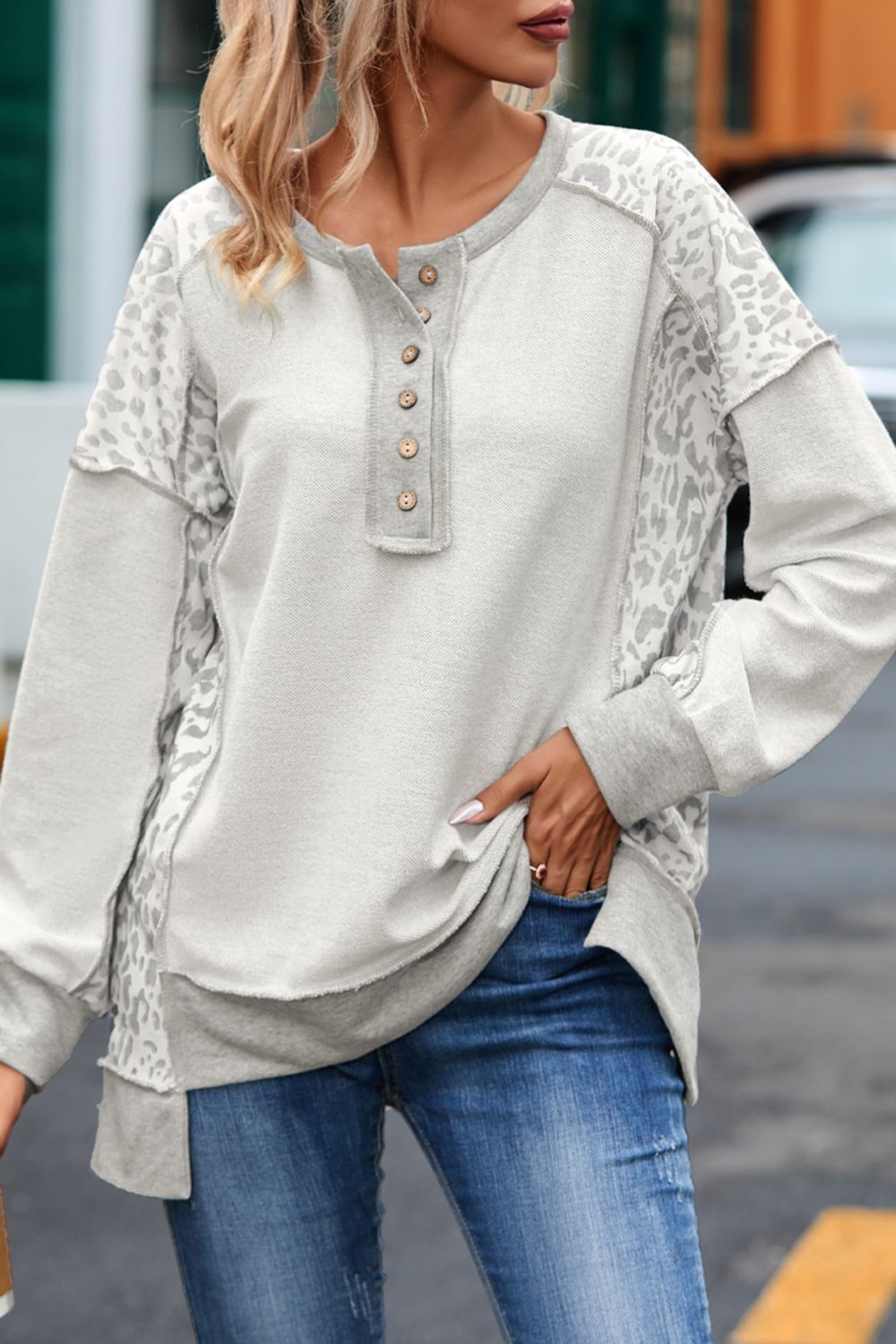 Front view of Exposed Seam Leopard Long Sleeve Sweatshirt in Light Gray showing neckline and sleeve details