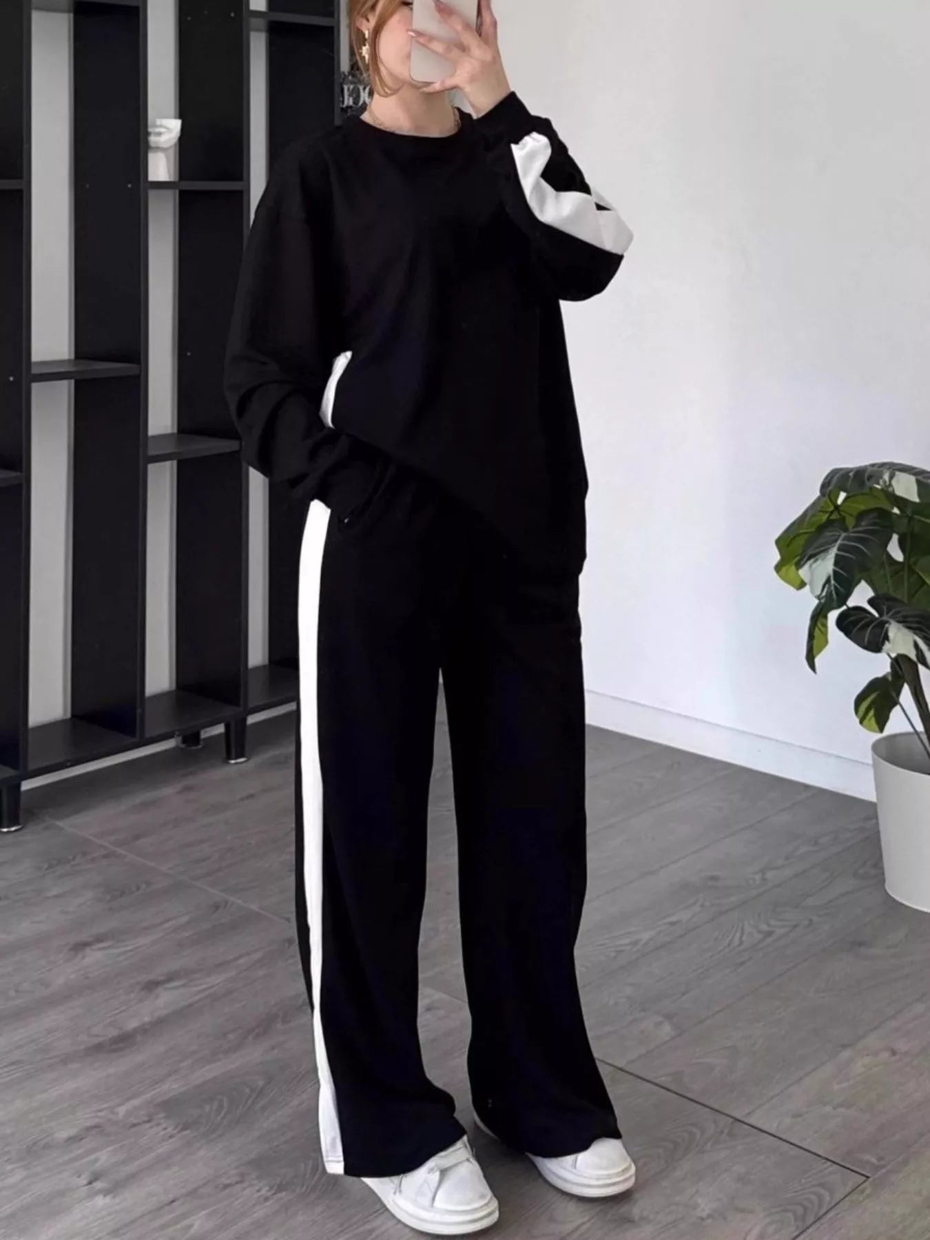 Front view of Full Size Contrast Round Neck Top and Pants Set Plus Size in Black showing neckline and sleeve details