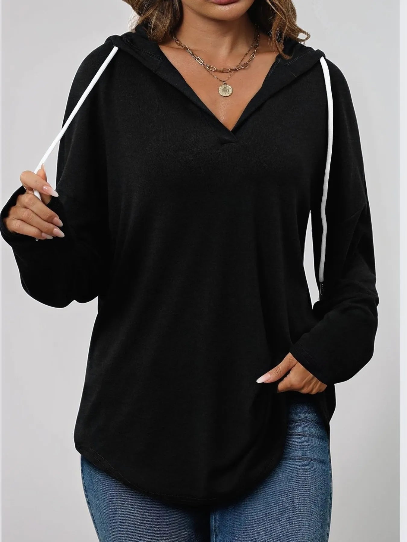 Front view of Full Size Drawstring Long Sleeve Hoodie Plus Size in Black showing neckline and sleeve details (95% polyester)