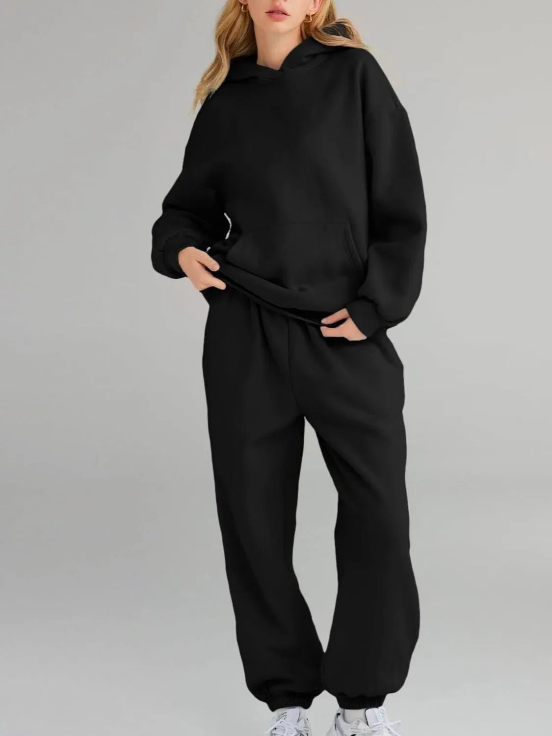 Front view of Full Size Kangaroo Pocket Hoodie and Joggers Set Plus Size in Black showing neckline and sleeve details