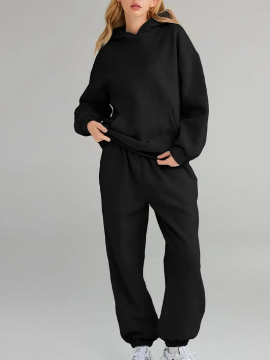 Front view of Full Size Kangaroo Pocket Hoodie and Joggers Set Plus Size in Black showing neckline and sleeve details