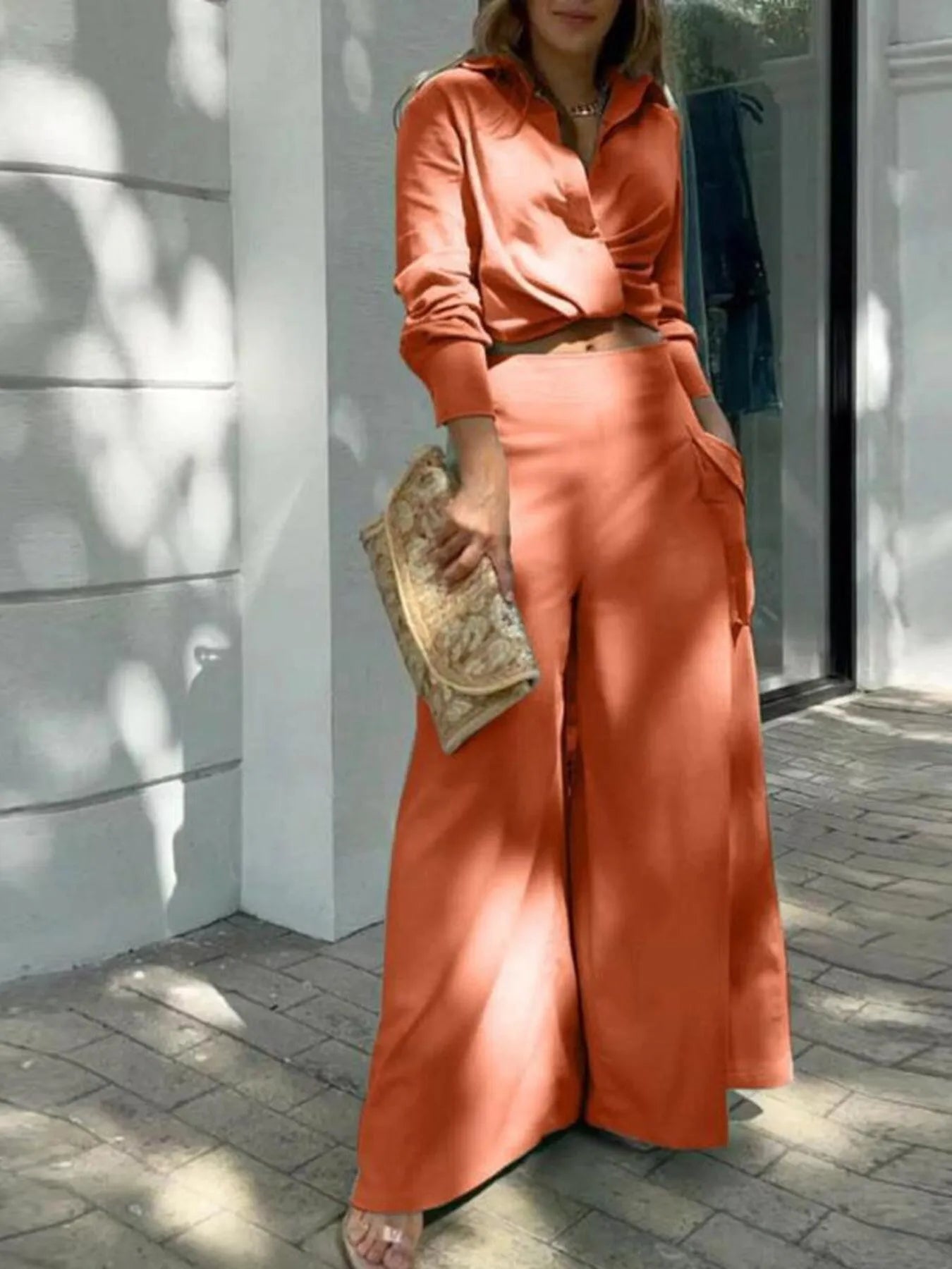 Front view of Full Size Long Sleeve Top and Pants Set Plus Size in Orange showing neckline and sleeve details