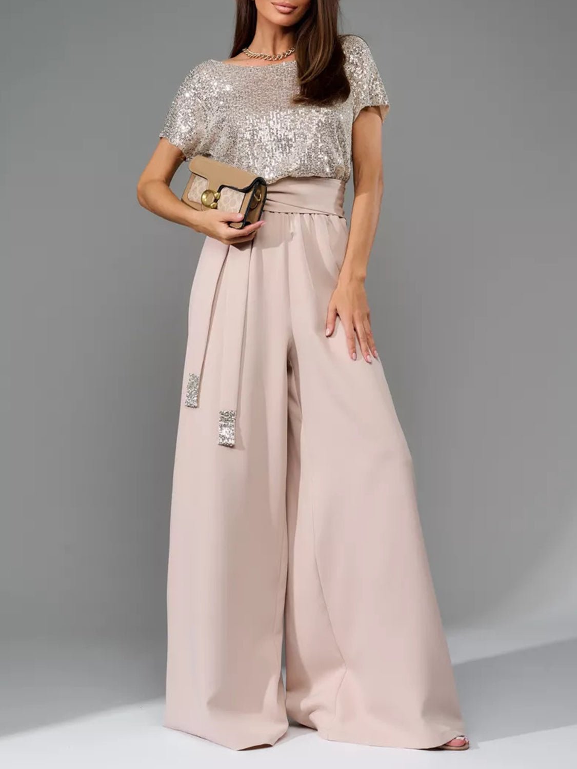 Front view of Full Size Sequin Round Neck Short Sleeve Wide Leg Jumpsuit in Eggshell showing neckline and sleeve details