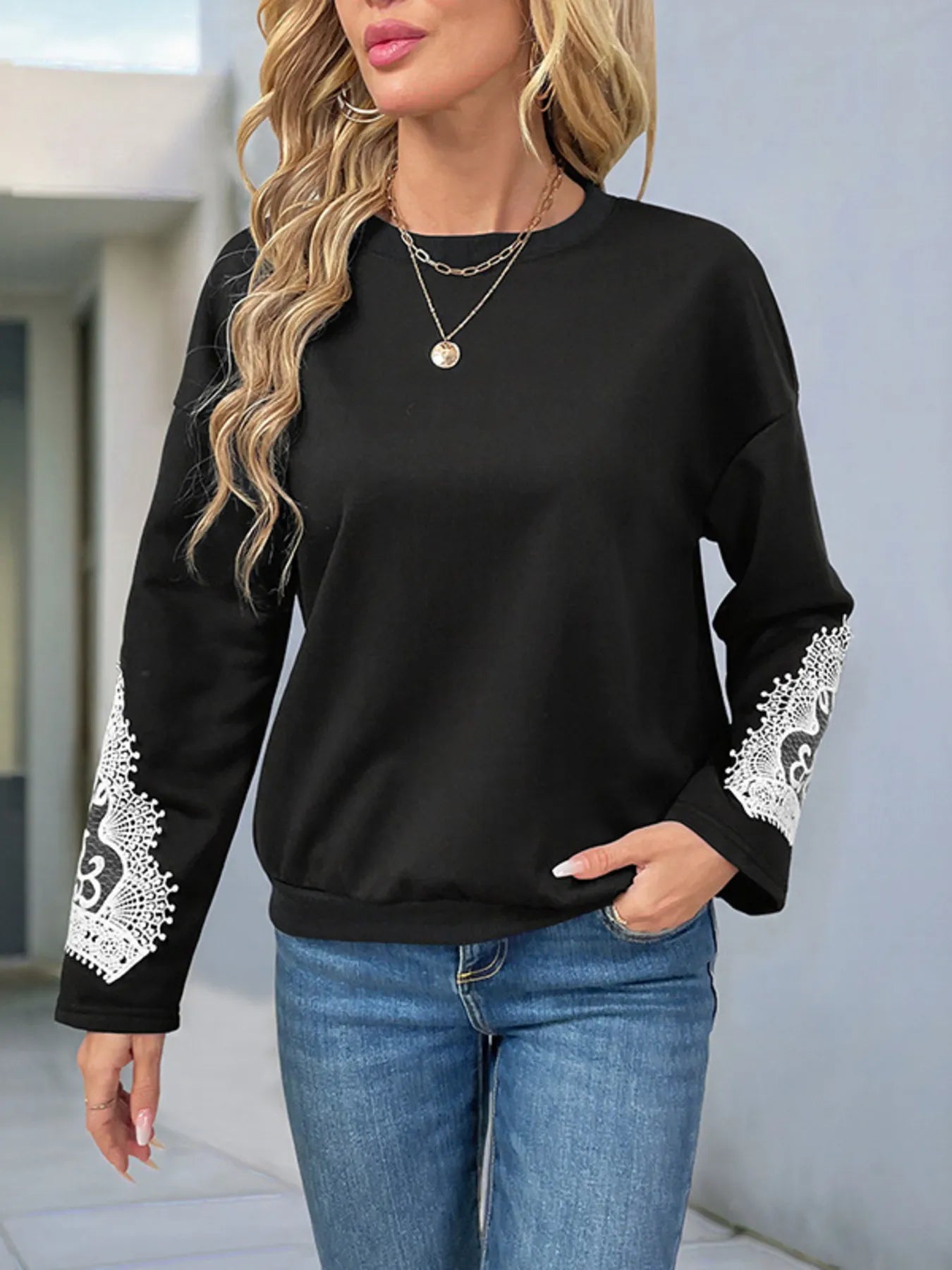 Front view of Lace Detail Long Sleeve Sweatshirt in Black showing neckline and sleeve details