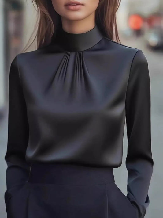 Front view of Mock Neck Long Sleeve Blouse with Pleated Detail in Black showing neckline and sleeve details
