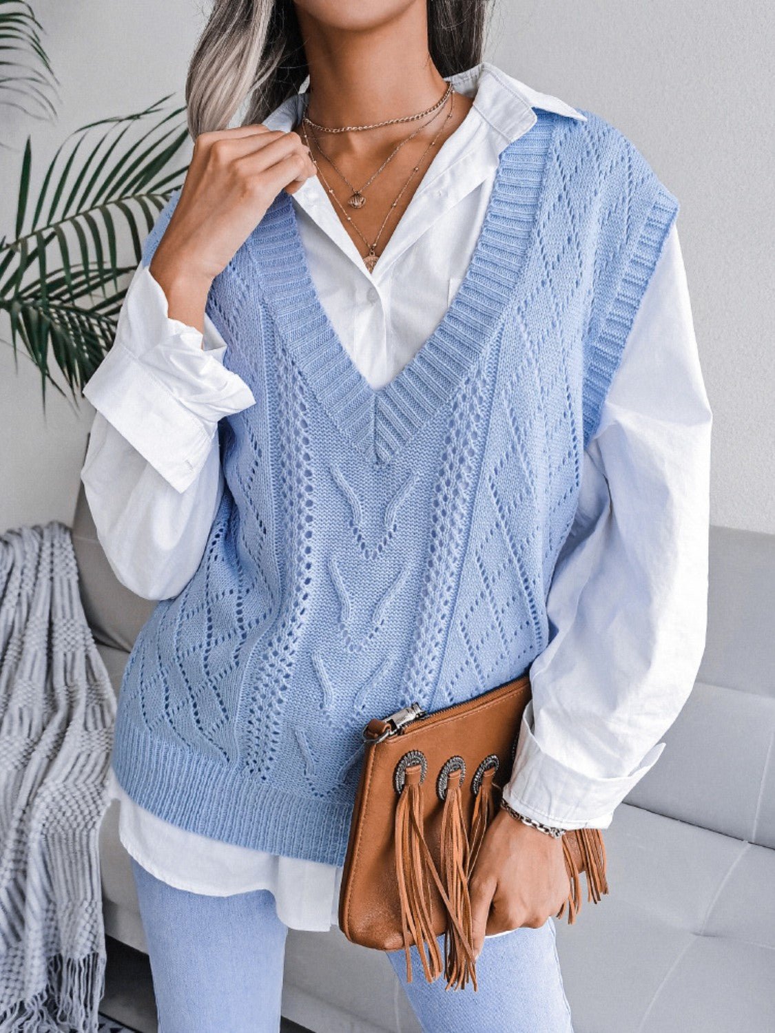 Front view of Openwork V-Neck Sweater Vest in Light Blue showing neckline and sleeve details (100% acrylic Care instructions)