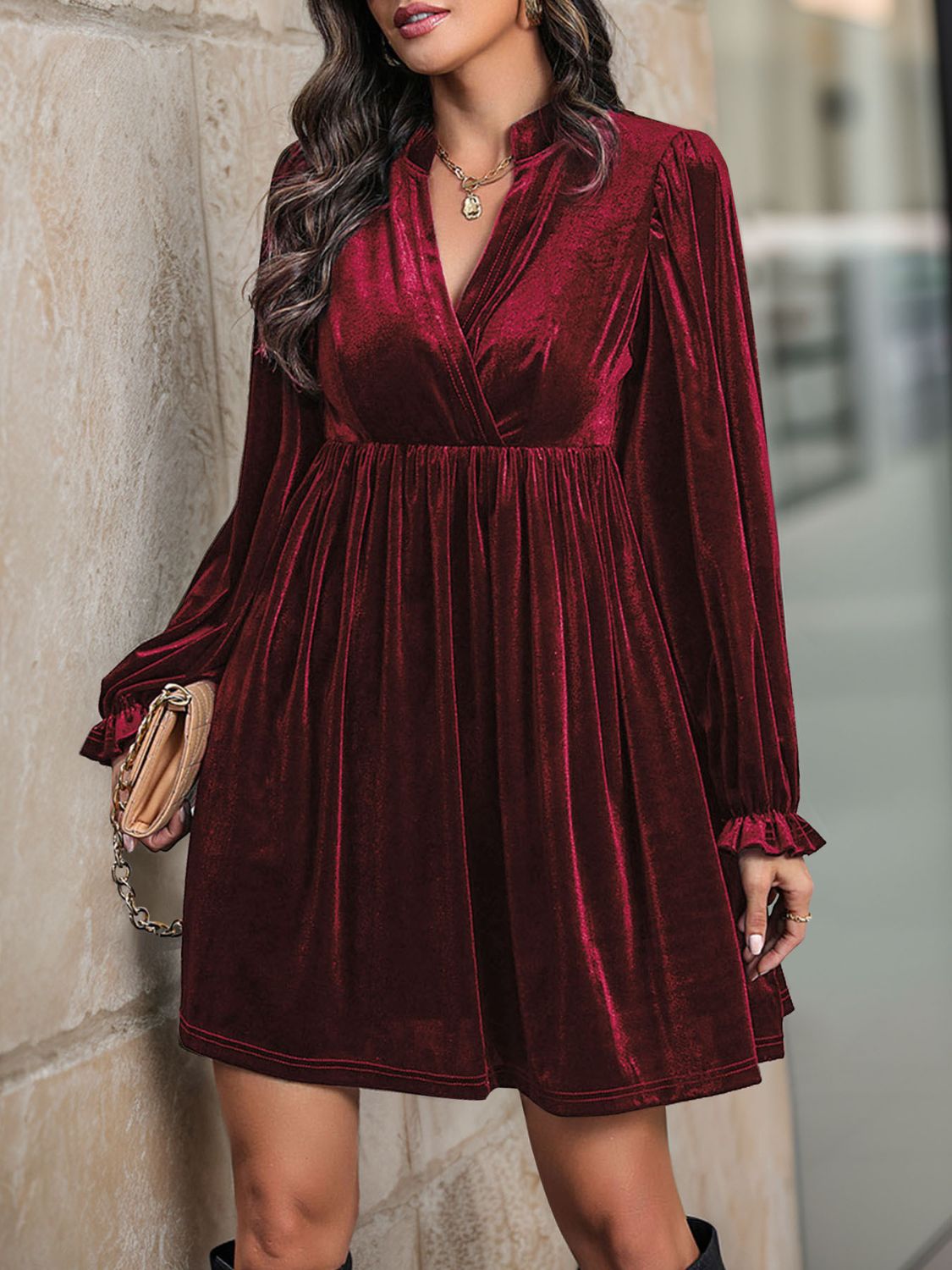 Front view of Perfee Ruched Surplice Long Sleeve Mini Dress in Burgundy showing neckline and sleeve details