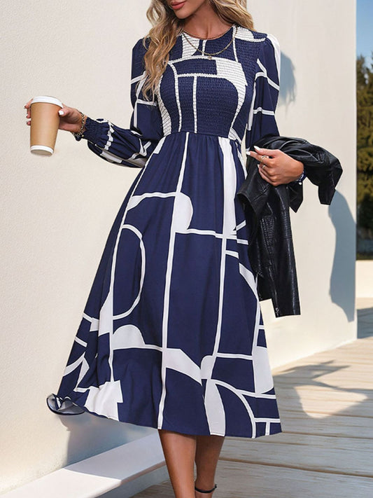 Front view of Perfee Smocked Color Block Long Sleeve Midi Dress in Dark Navy showing neckline and sleeve details