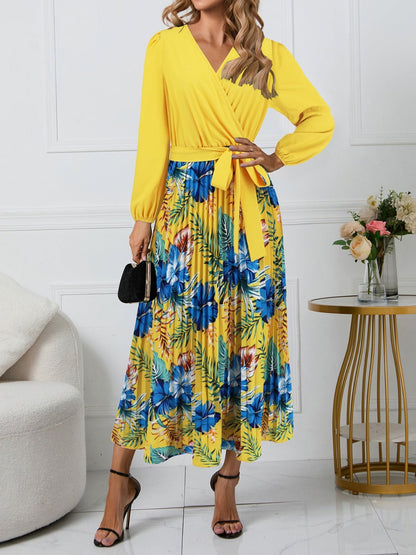 Front view of Pleated Printed Surplice Long Sleeve Dress in Yellow showing neckline and sleeve details