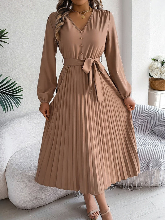 Front view of Pleated Tied V-Neck Long Sleeve Dress in Camel showing neckline and sleeve details