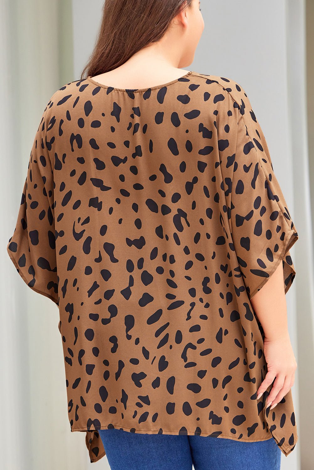 Plus Size Animal Print Handkerchief Hem Blouse - Rochelle's House LLC