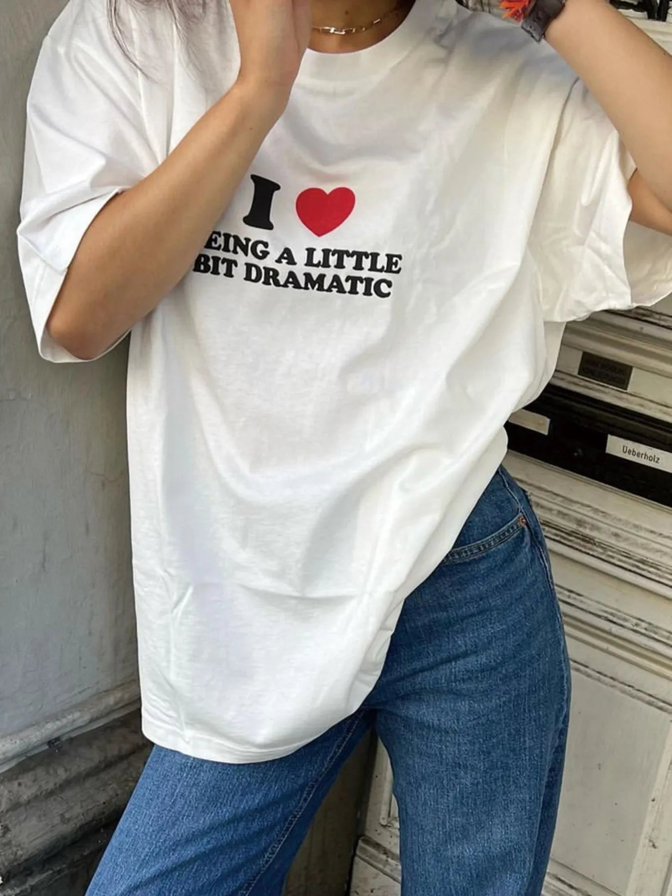 Front view of Plus Size Letter Graphic Round Neck Short Sleeve T-Shirt in White showing neckline and sleeve details