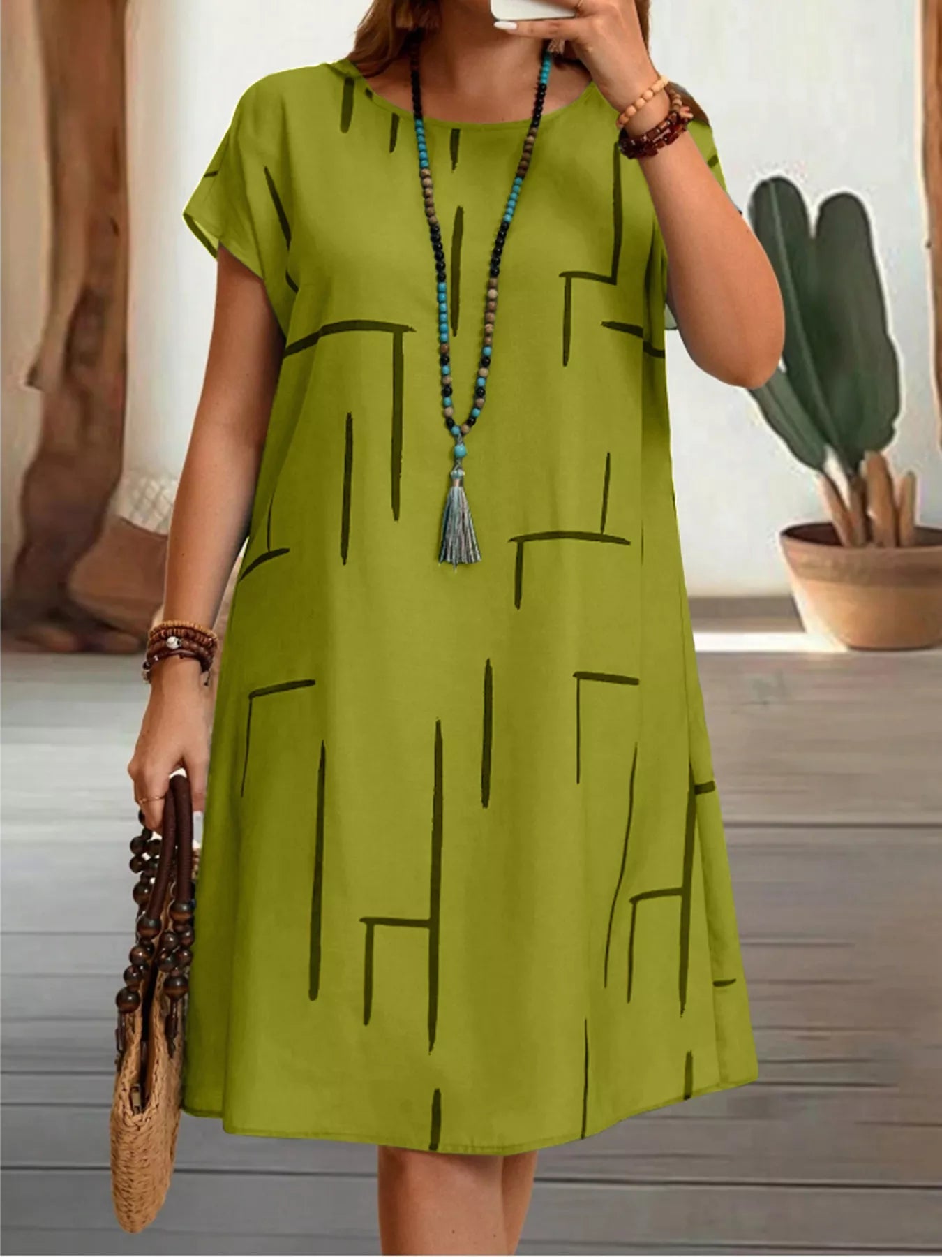 Front view of Plus Size Round Neck Short Sleeve Dress in Lime showing neckline and sleeve details (100% polyester)