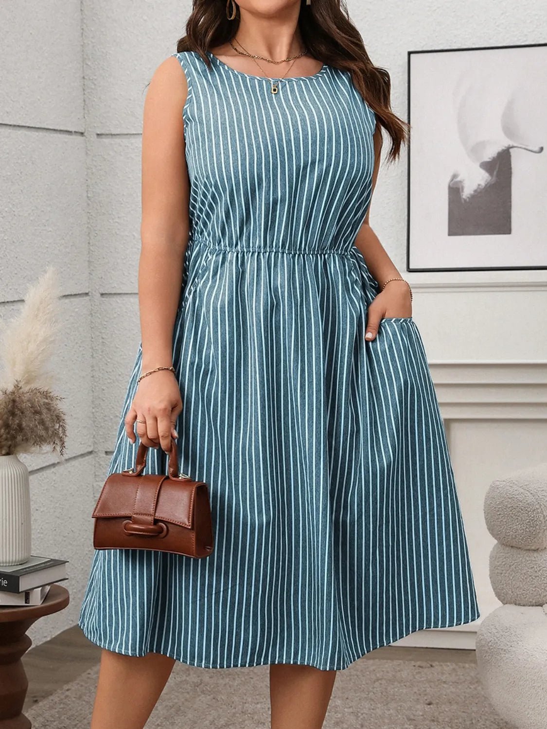 Front view of Plus Size Striped Round Neck Sleeveless Dress in Teal showing neckline and sleeve details