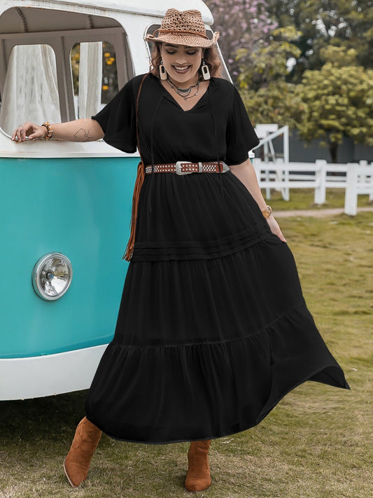 Front view of Plus Size Tie Neck Flutter Sleeve Dress in Black showing neckline and sleeve details