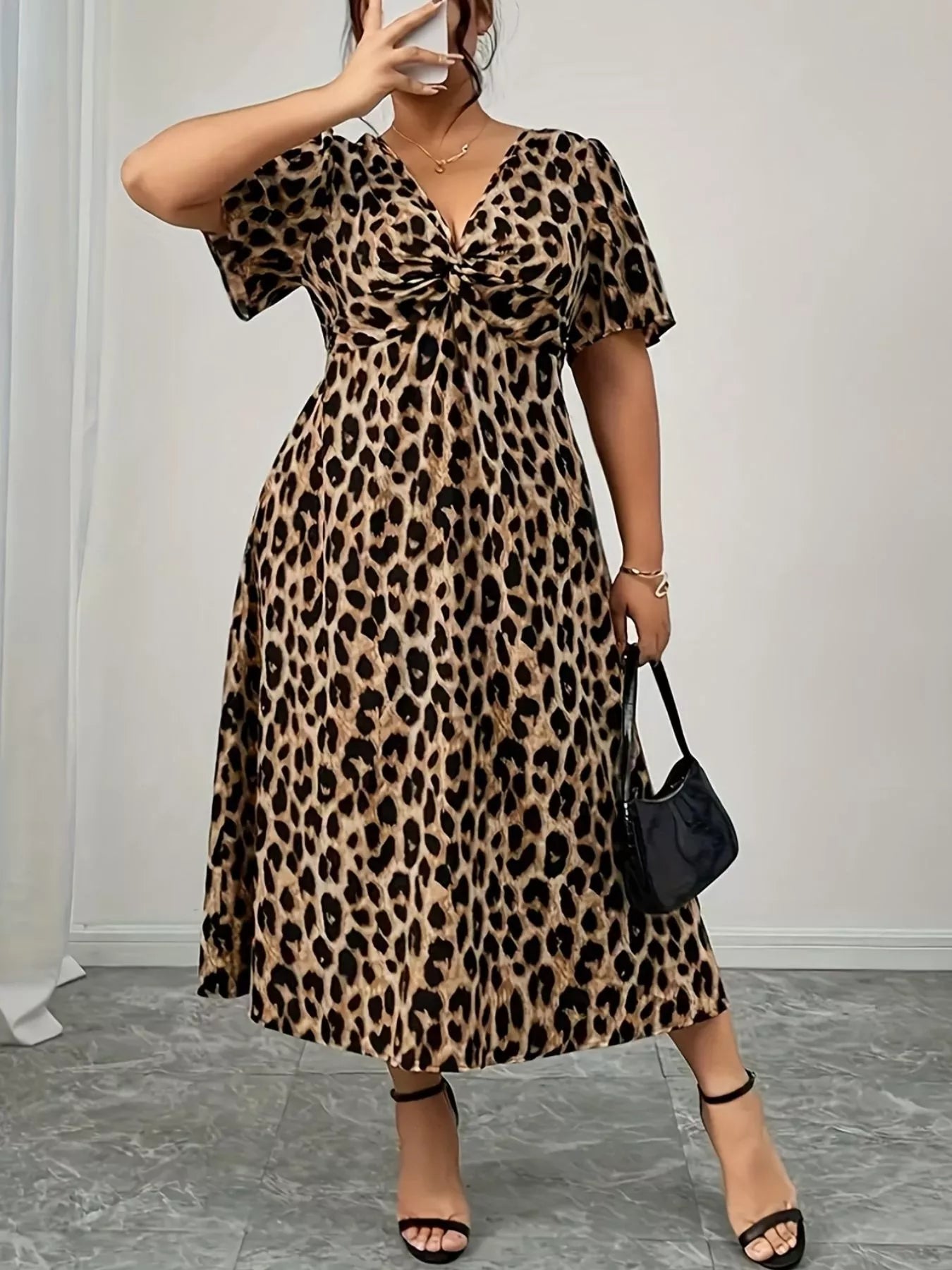 Front view of Plus Size Twisted Front Leopard Short Sleeve Dress in Leopard showing neckline and sleeve details