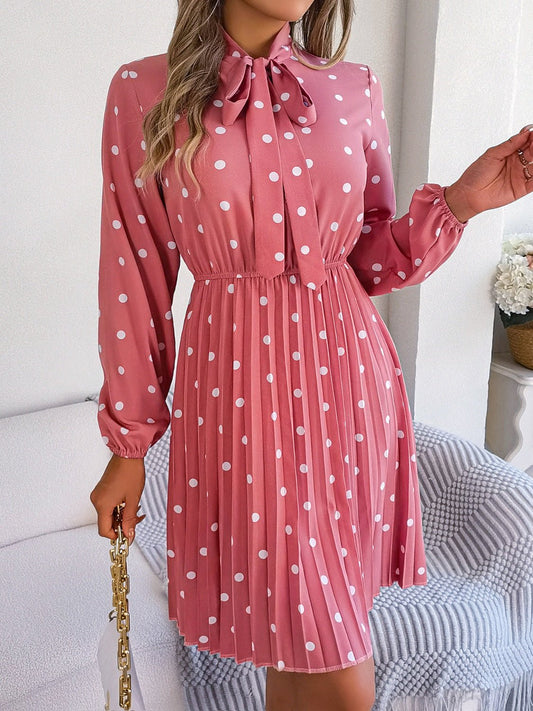 Front view of Polka Dot Tie Neck Pleated Dress in Hot Pink showing neckline and sleeve details
