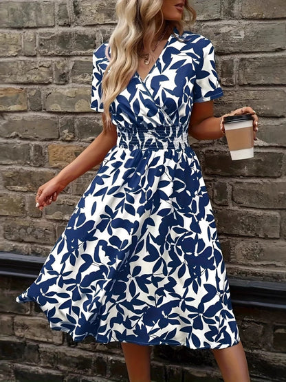 Front view of Printed Smocked Surplice Short Sleeve Dress in Peacock  Blue showing neckline and sleeve details