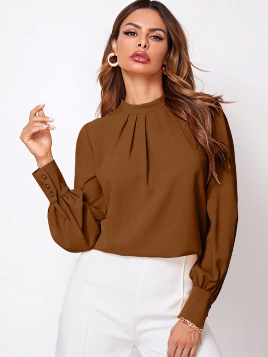 Front view of Ruched Mock Neck Long Sleeve Blouse in Brown showing neckline and sleeve details