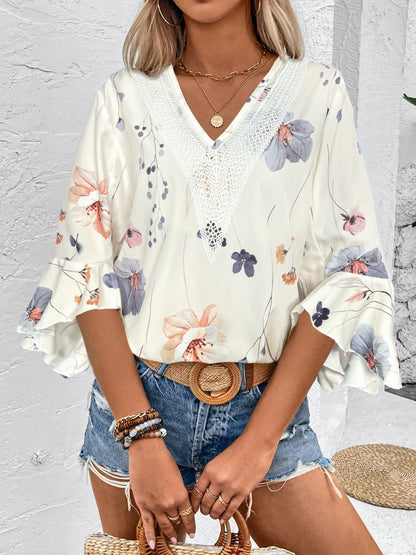 Ruffled Printed V - Neck Half Sleeve Blouse - Rochelle's House LLC