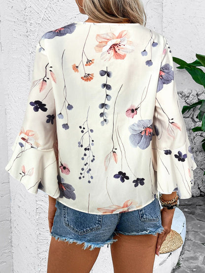 Ruffled Printed V - Neck Half Sleeve Blouse - Rochelle's House LLC