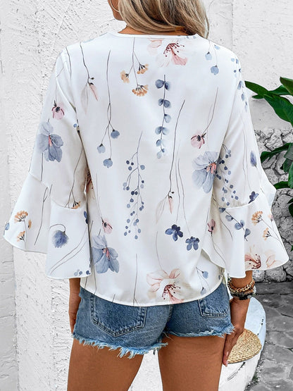 Ruffled Printed V - Neck Half Sleeve Blouse - Rochelle's House LLC