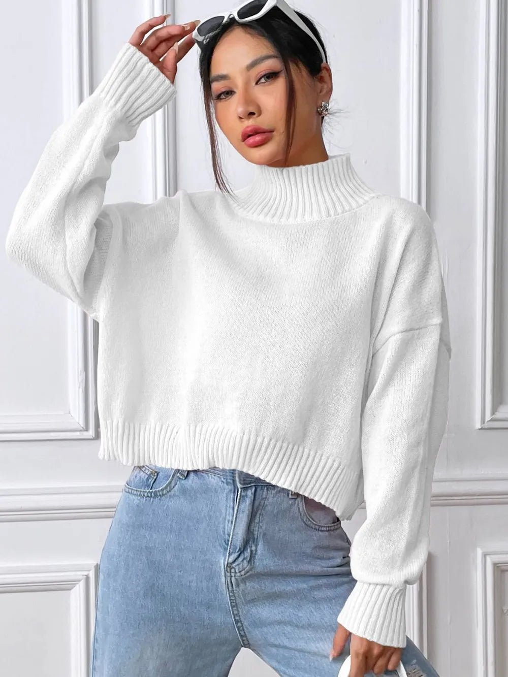 Front view of Turtleneck Long Sleeve Sweater in White showing neckline and sleeve details (100% polyester Care instructions)