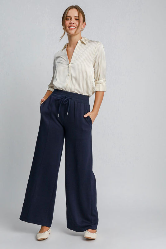 Front view of Umgee Drawstring Wide Leg Pants with Pockets in Midnight showing neckline and sleeve details